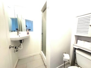 Bathtub, hair dryer, towels, soap