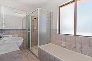 Bathtub, towels, toilet paper