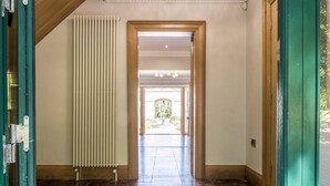 A hallway with a radiator, wooden door frames, and a view into a well-lit room. - LE 23 · Escape Ordinary at Castle Hume No.23 ~ Luxury (Fermanagh and Omagh)