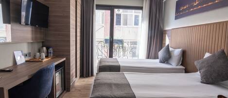 Standard Double or Twin Room | Minibar, in-room safe, desk, laptop workspace