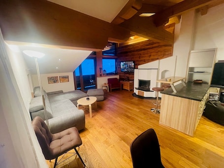 Comfort Apartment | Living area | 50-inch flat-screen TV with satellite channels. NaturSport Heutal