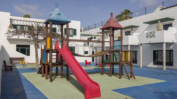 Children can play on the multi-level structure with a slide.