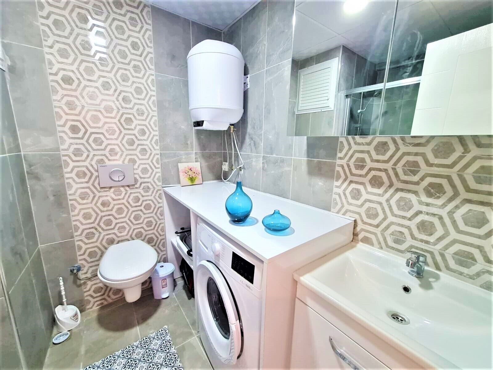 deluxe apartment | bathroom | shower, rainfall showerhead, hair dryer