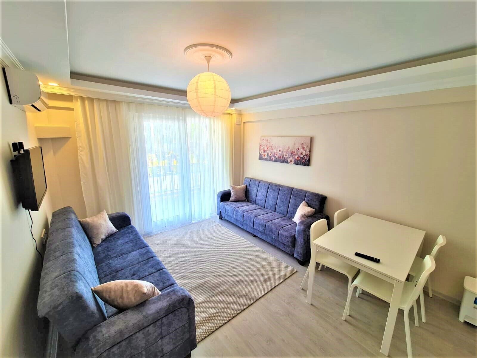 deluxe apartment | premium bedding, desk, laptop workspace, iron/ironing board