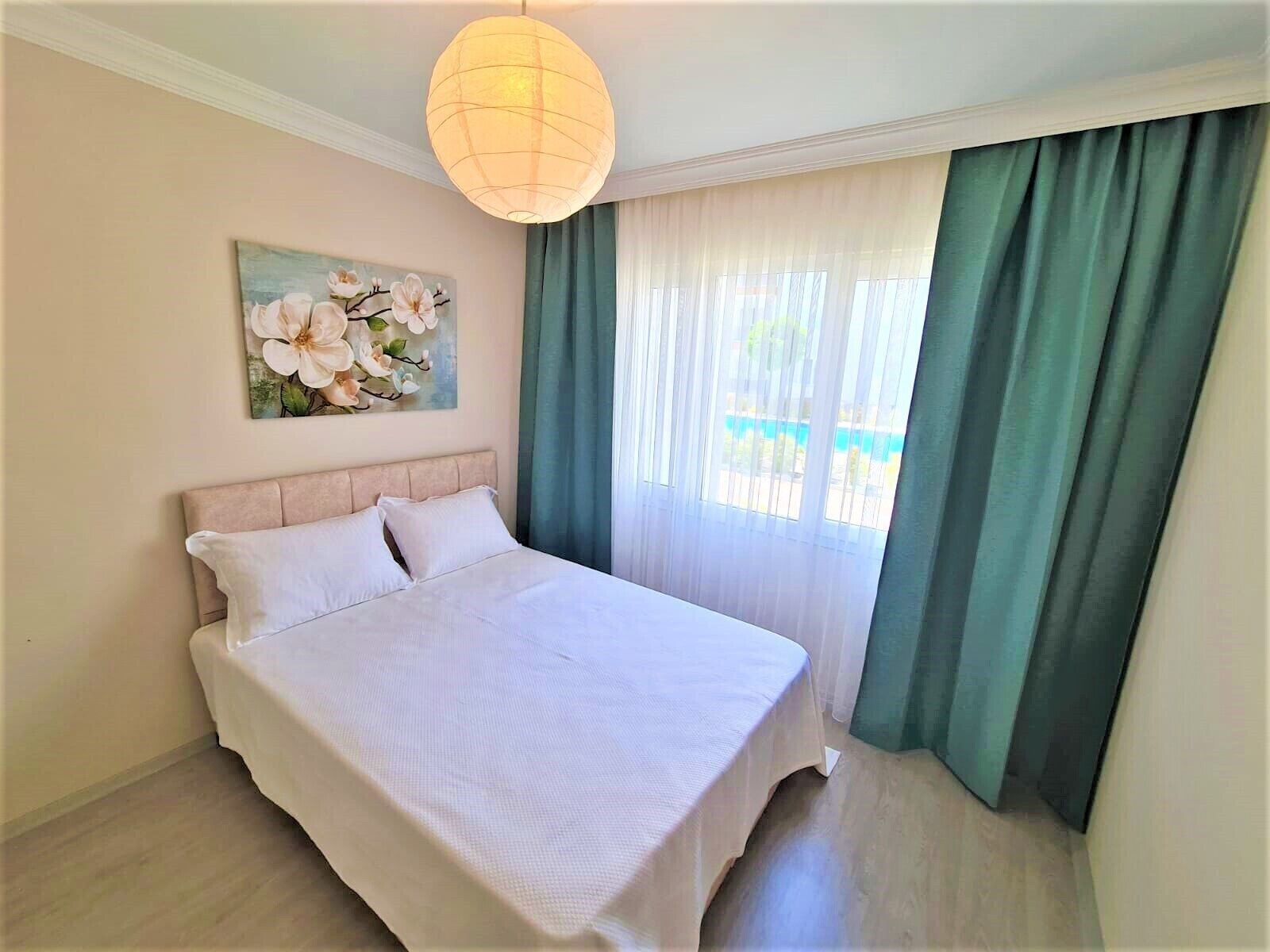 deluxe apartment | premium bedding, desk, laptop workspace, iron/ironing board