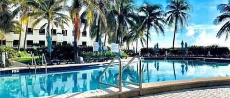 2 outdoor pools, open 8:00 AM to 7:00 PM, pool umbrellas, pool loungers