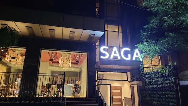 The exterior of a building with a sign that reads "SAGA." - The Saga Hotel (New Delhi)