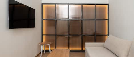 Family-Two Bedroom Suite with Balcony & Panoramic Lake and City View | Living area | 32-inch Smart TV with satellite channels, TV