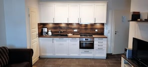 Fridge, stovetop, toaster, cookware/dishes/utensils