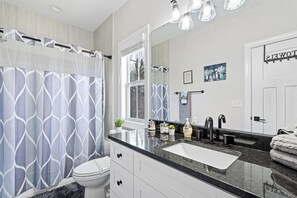 Combined shower/bathtub, hair dryer, towels, soap