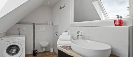 Shower, towels, soap, toilet paper