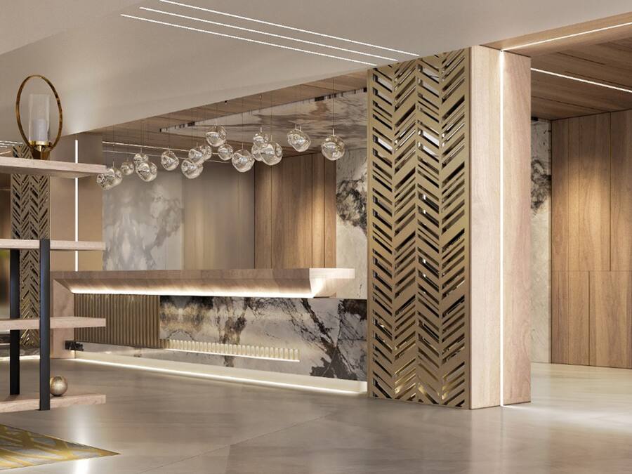 Un interior moderno con pared de mármol, paneles de madera y una estantería elegante e iluminada.