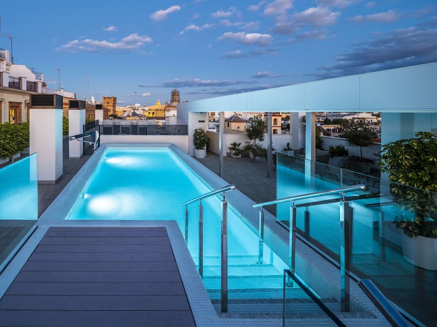 Seasonal outdoor pool, open 9:30 AM to 8:00 PM, pool umbrellas
