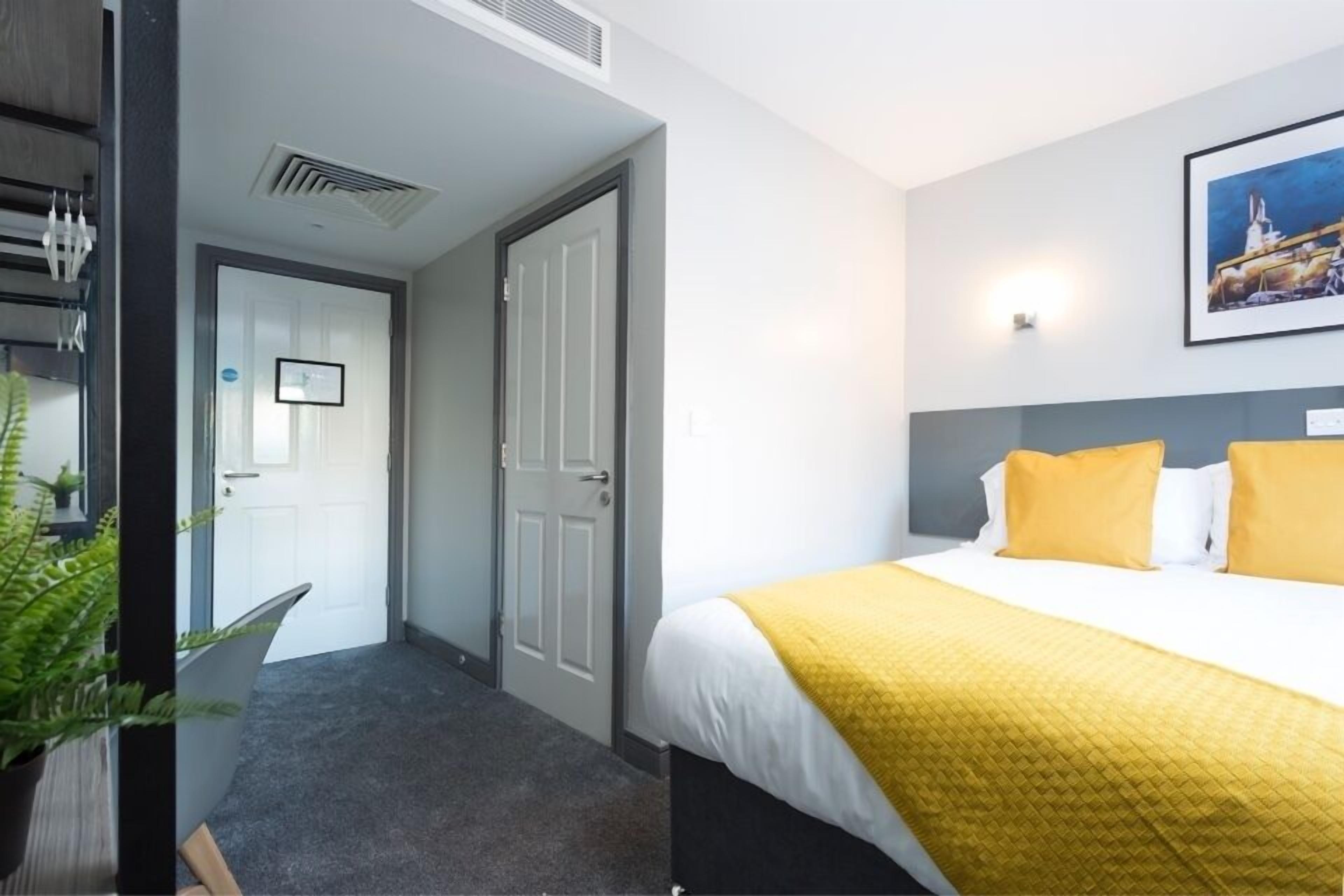 memory-foam beds, desk, laptop workspace, iron/ironing board