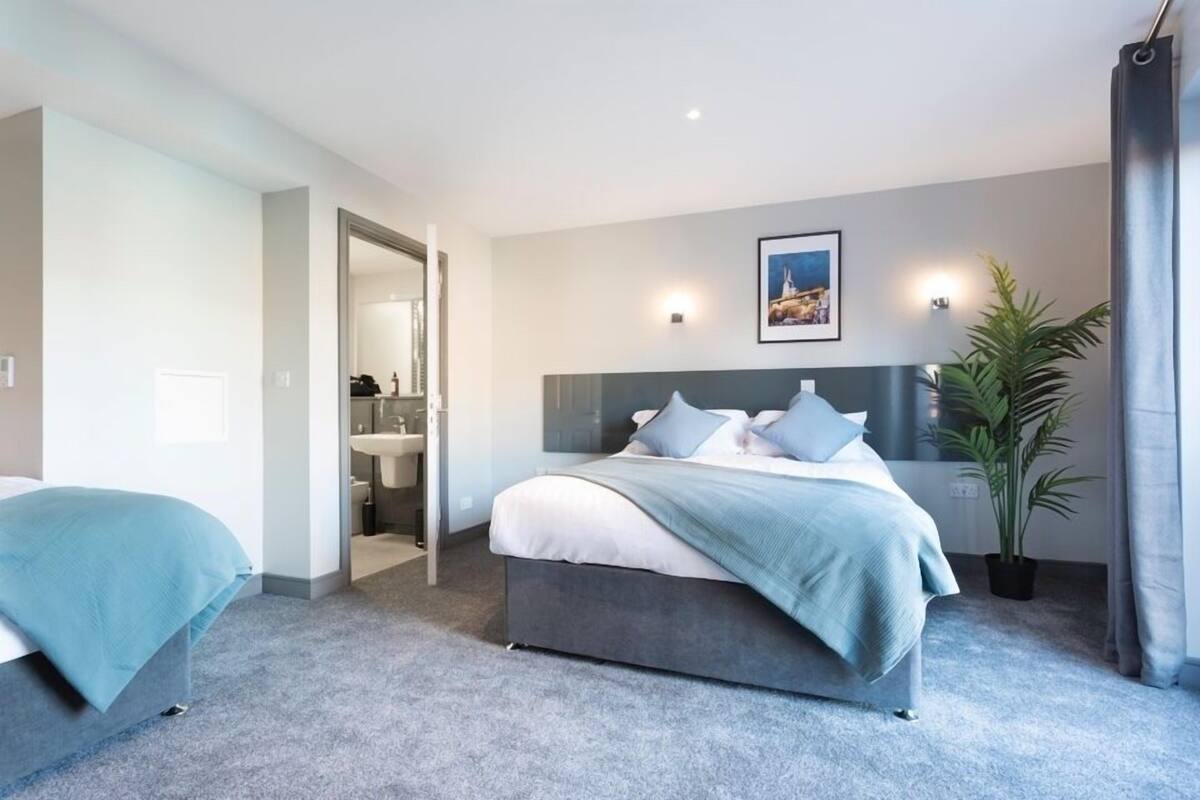 memory-foam beds, desk, laptop workspace, iron/ironing board
