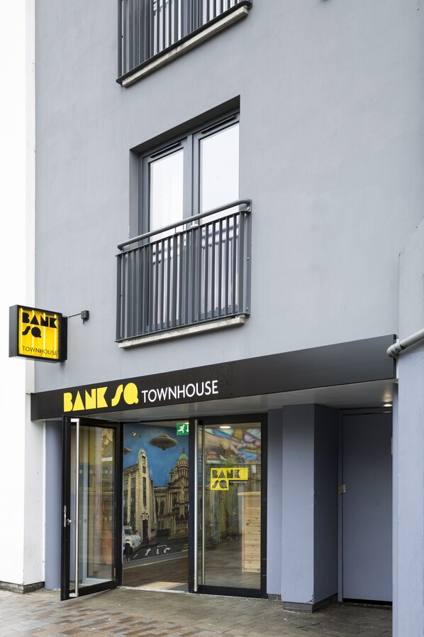 A building with a sign reading "BANK SQ TOWNHOUSE". - Bank Sq by the Warren Collection (Belfast)