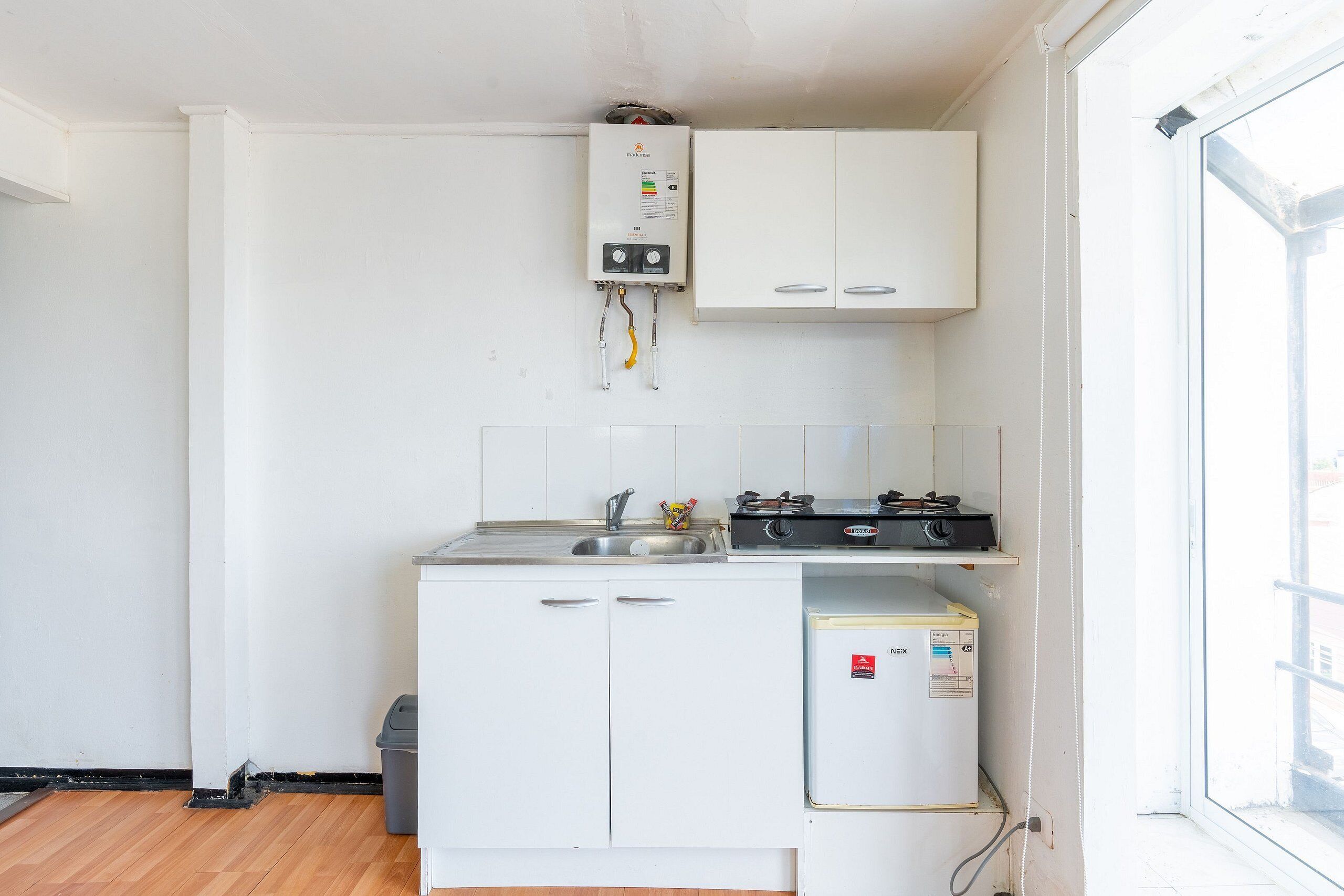 Apartment | Private kitchen | Mini-fridge, toaster, cookware/dishes/utensils, cleaning supplies