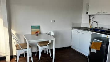 Apartment | Private kitchen | Mini-fridge, toaster, cookware/dishes/utensils, cleaning supplies