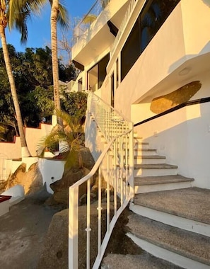 Stunning building with a balcony and garden area, offering a peaceful retreat.