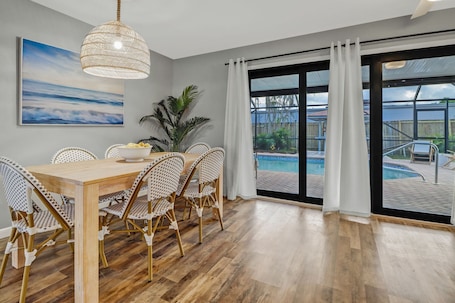 Dining. Modern Pool Home • Central Fort Myers Location