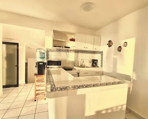 Fridge, microwave, stovetop, coffee/tea maker
