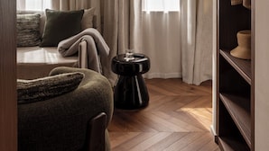 A room with a bed, a side table, a wardrobe, and a window with curtains. - Naman Hotellerie - Spagna (Rome)