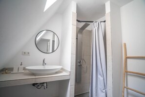 Combined shower/tub, hair dryer