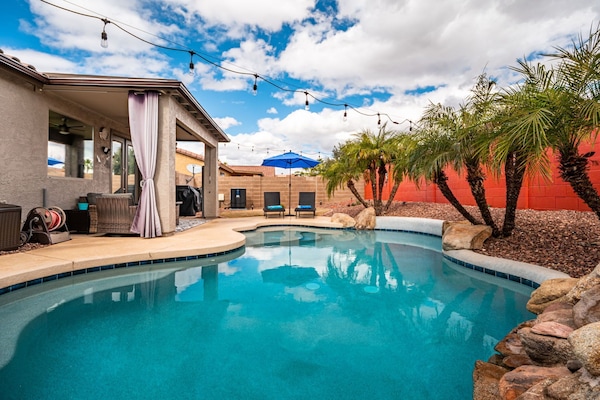 Beautiful, heated pool with sundeck and covered patio for lounging