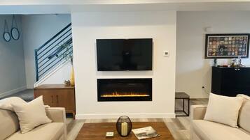 Smart TV, fireplace, books