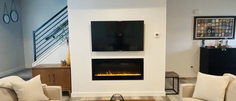 Smart TV, fireplace, books