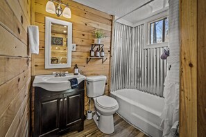 Combined shower/bathtub, towels, soap, shampoo
