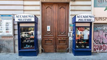 Two storefronts labeled "Accademia Militare" with display windows.