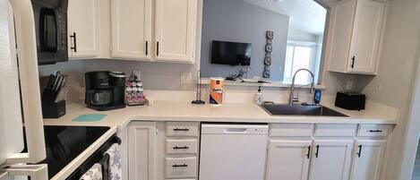 Coffee/tea maker, fridge, microwave, oven