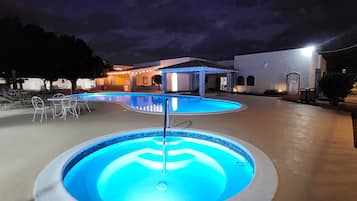 Outdoor pool, open 10:00 AM to 10:00 PM, pool umbrellas, pool loungers