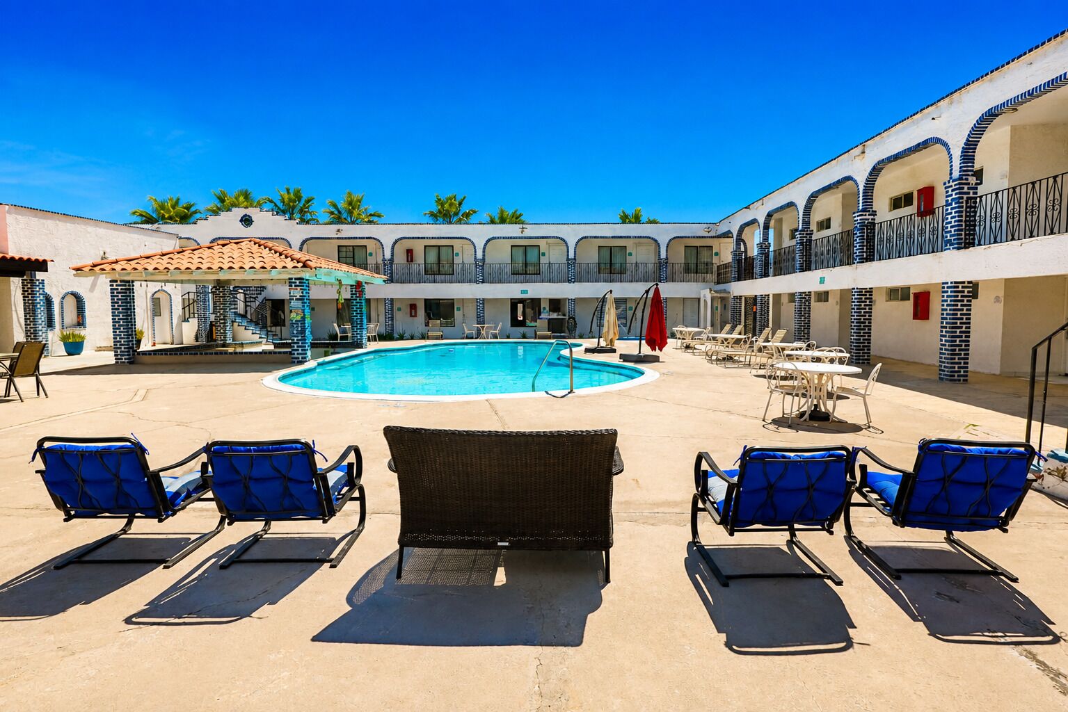 Outdoor pool, open 10:00 AM to 10:00 PM, pool umbrellas, pool loungers