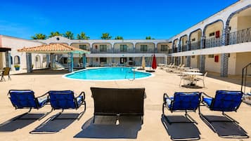 Outdoor pool, open 10:00 AM to 10:00 PM, pool umbrellas, pool loungers