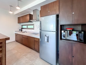 Fridge, microwave, stovetop, coffee/tea maker
