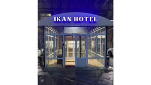 The exterior of Ikan Hotel with a glass entrance and a sign above. - Ikan Hotel Double 2 (Yakkasaray)