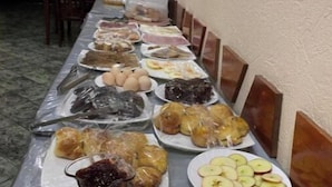 A buffet table with various food items including fruits, pastries, and a glass of juice. - Ikan Hotel twin 3 (Tashkent)