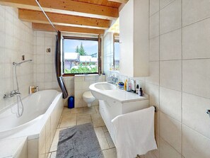 Bathtub, hair dryer, towels