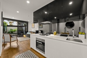 Apartment | Private kitchen | Full-size fridge, microwave, oven, stovetop - StayCentral - Hawthorn East - Study, 2 Car spaces (Hawthorn East)