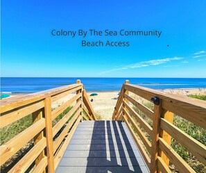 A wooden boardwalk leading to a beach with clear skies. - Just Duck Inn - Bright, Cheerful, 2BR/2BA Semi-Oceanfront condo in Duck, Sleeps 4-7 (Duck)