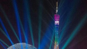 A tower with a spire and a dome structure in the foreground. - Jinpeng Hotel (Guangzhou Yongqingfang Chenjiaxuan Subway Station) (Guangzhou)