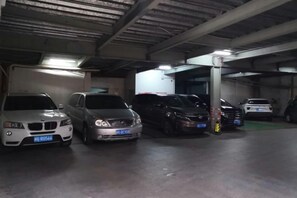 A parking garage with multiple cars parked in rows. - Haolilai Grand Hotel (Sanming No.1 High School) (Sanming)