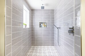 Bathtub, hair dryer, towels, soap