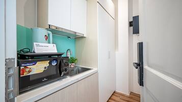 Fridge, microwave, cookware/dishes/utensils, cleaning supplies