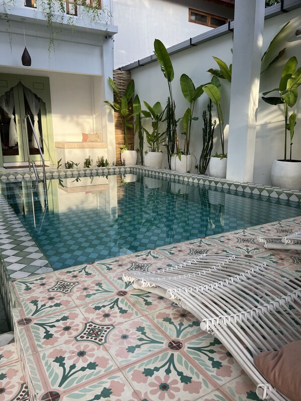 Outdoor pool, open 8:00 AM to 10:00 PM, sun loungers