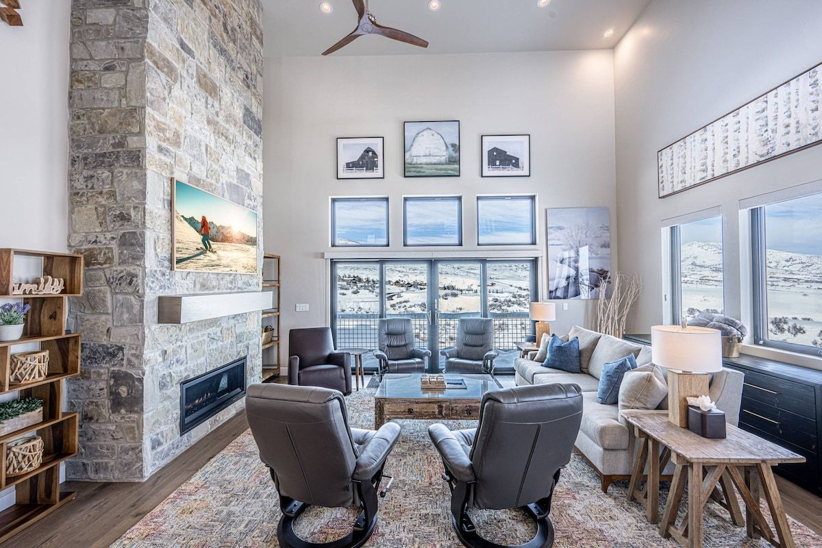 Featuring a large natural rock fireplace, 65" Samsung The Frame Smart TV and comfortable furnishings. It's the perfect place to gather and enjoy a mov