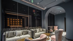 A modern lounge area with a sofa set, armchairs, and a coffee table. - CC Palace Hotel Roma (Rome)