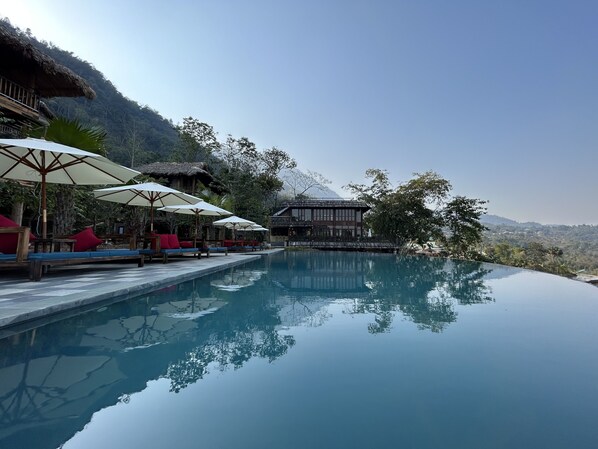 Outdoor pool, pool umbrellas, pool loungers